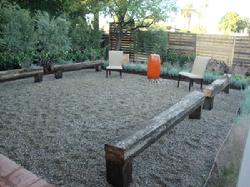 Gravel Patio with Focal Fountian and Used Railroad Tie Benches