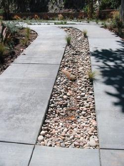 Driveway Stream - Water flows from the top to the bottom over the rocks and is recirculated back